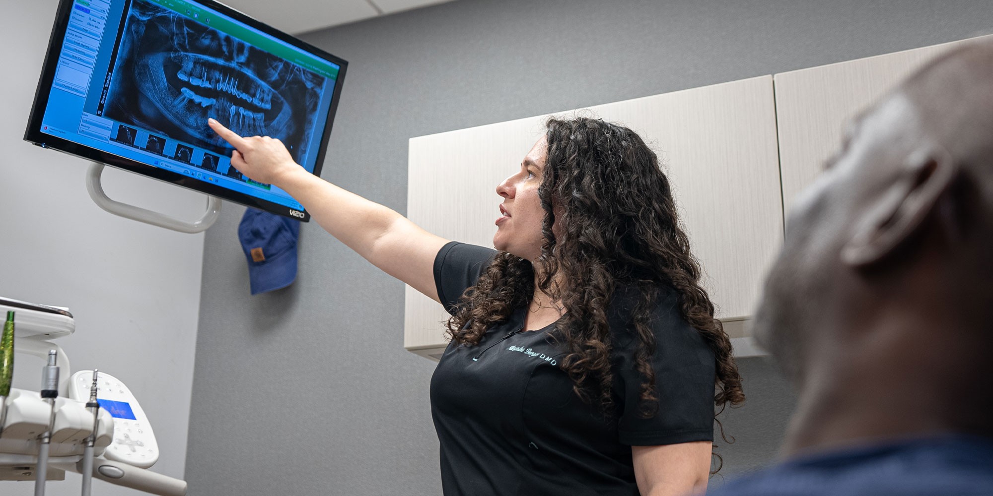 doctor pointing something on a screen