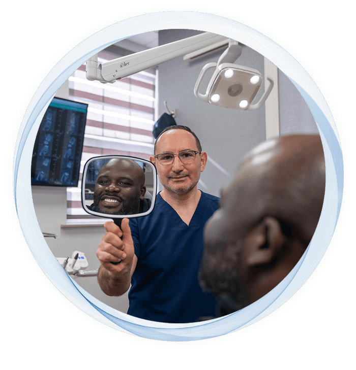 doctor holding a mirror in front of a patient